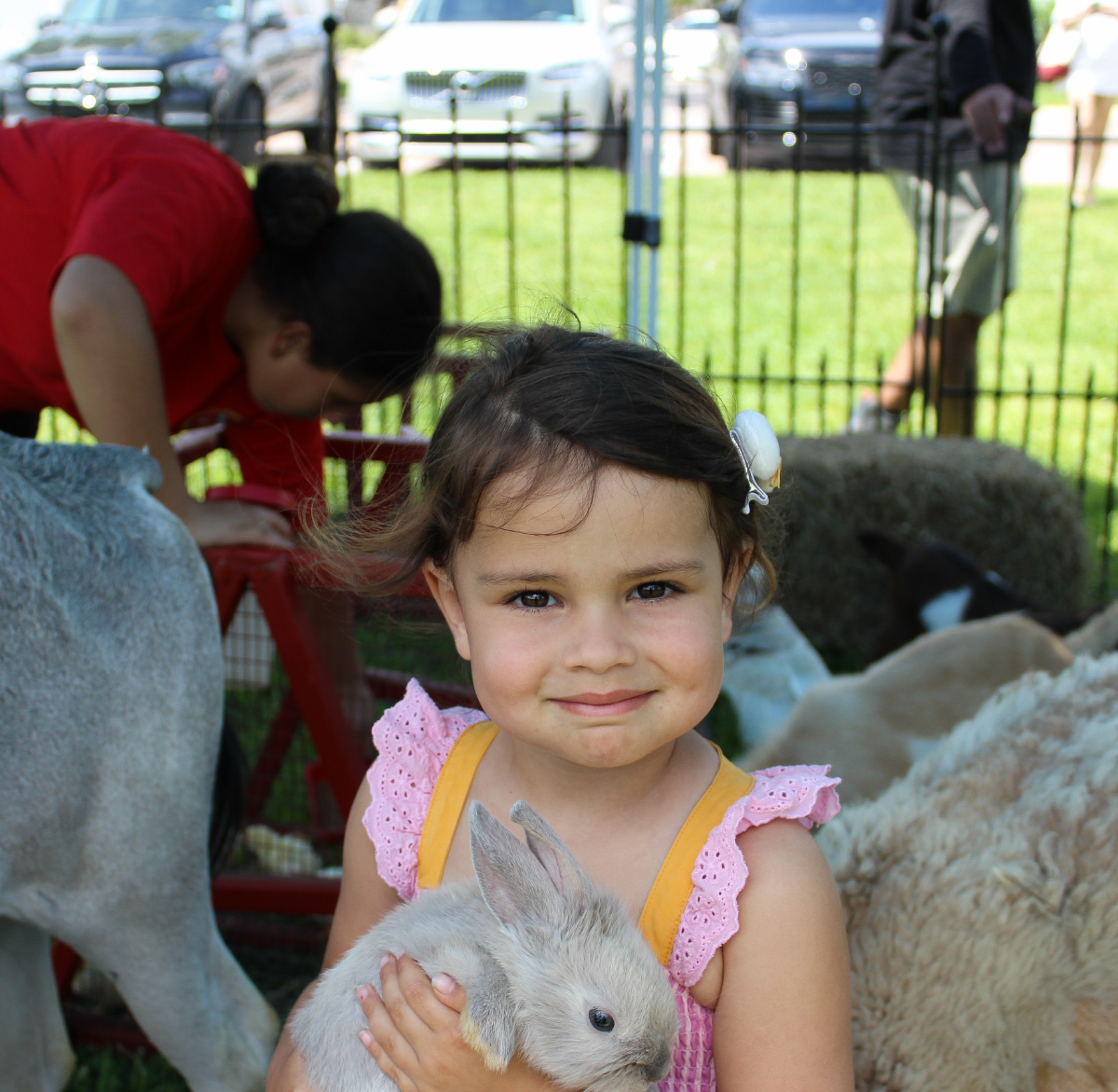Girl-holding-bunny-petting-zoo–-Club-at-Barefoot-Beach