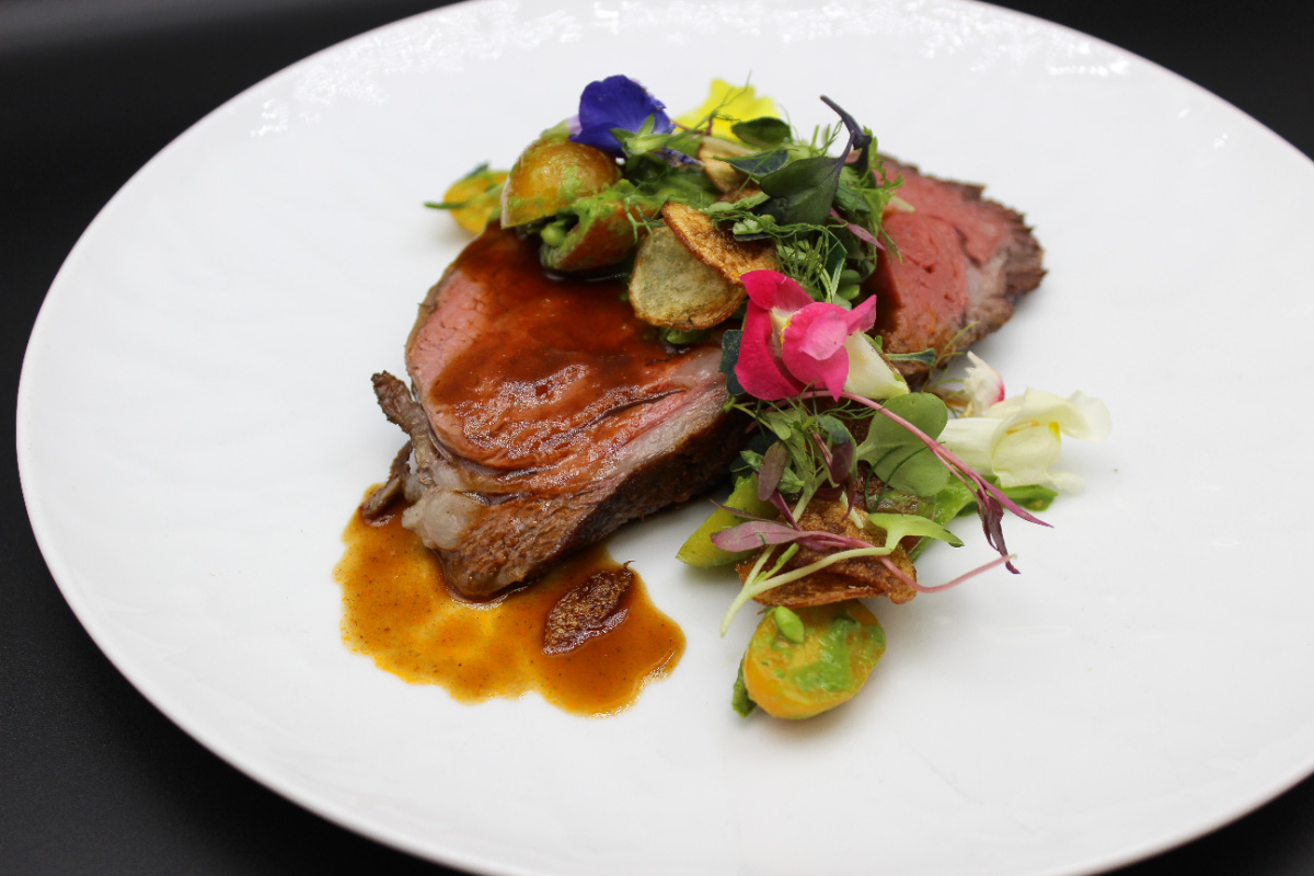 Gourmet-Prime-Rib-with-Edible-Flowers–-Club-at-Barefoot-Beach